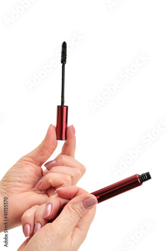 Photo: mascara in hand isolated on white background mascara in hand isolated on white background