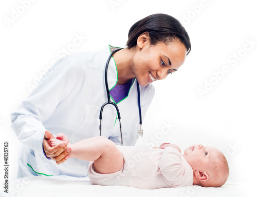 Photo: Doctor and baby on a white background Doctor and baby on a white background