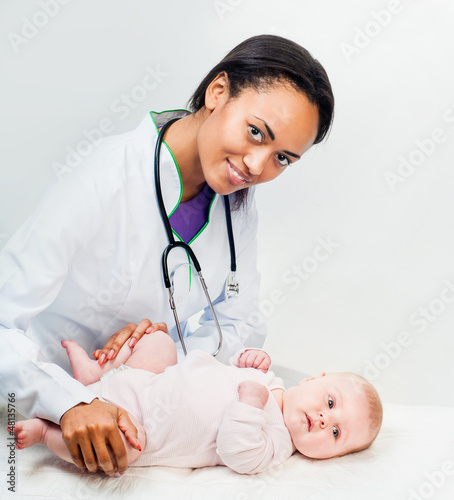 Photo: Doctor and baby on a white background Doctor and baby on a white background