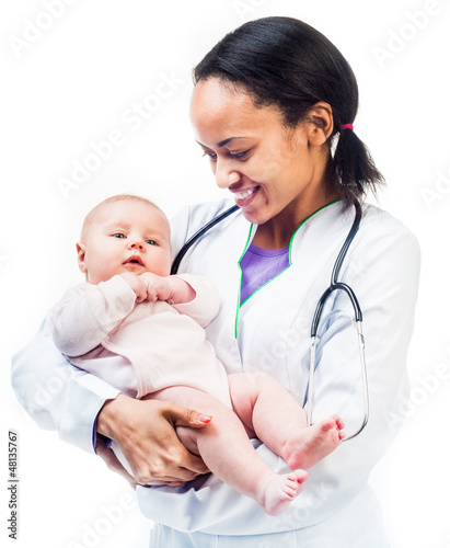Photo: Doctor and baby on a white background Doctor and baby on a white background
