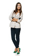 Full length of woman in jacket and gloves standing