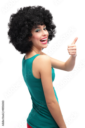 Photo: Girl with afro showing thumbs up Girl with afro showing thumbs up
