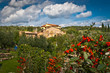 Photo: Landscape with tuscany architecture and garden in foreground. Landscape with tuscany architecture and garden in foreground.