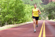 Runner man running on road