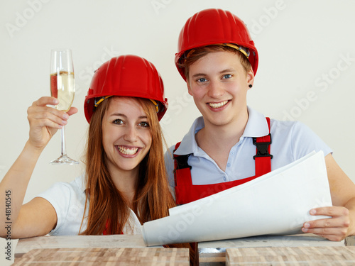 Photo: Young couple are happy to fix up a house Young couple are happy to fix up a house