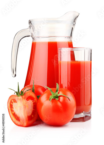 Photo: Jug and glass of tomato juice with fruits isolated Jug and glass of tomato juice with fruits isolated