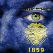 Flag painted on face with green eye to show Oregon support