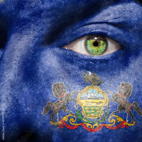 Photo: Flag painted on face with green eye to show Pennsylvania support Flag painted on face with green eye to show Pennsylvania support