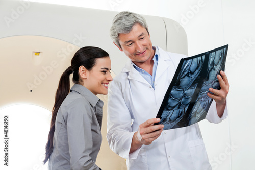 Photo: Radiologist Showing X-ray Report To Patient Radiologist Showing X-ray Report To Patient
