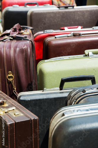 Photo: Pile of old vintage bag suitcases Pile of old vintage bag suitcases