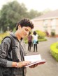 Indian / Asian college student studying on campus