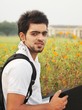 Indian / Asian college student studying outdoor.
