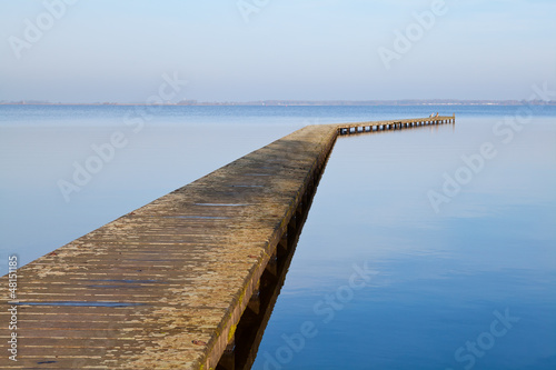 Photo: long wooden pier on big lake long wooden pier on big lake