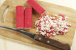 Photo: Crab sticks on a board cutted for salad Crab sticks on a board cutted for salad