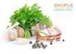 Pieces of bacon are with the bunch of green parsley