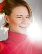 Laughing girl in a red turtleneck closeup
