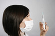 Nurse in mask with syringe