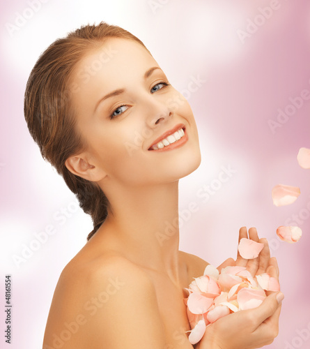 Photo: beautiful woman with rose petals beautiful woman with rose petals