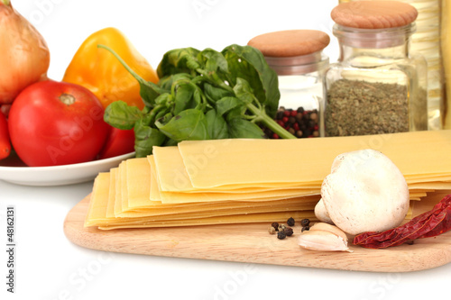 Photo: Vegetarian lasagna ingredients isolated on white Vegetarian lasagna ingredients isolated on white
