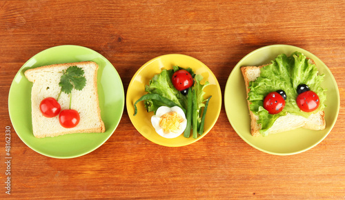 Photo: fun food for kids on wooden background fun food for kids on wooden background
