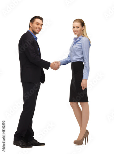 Photo: man and woman shaking their hands man and woman shaking their hands