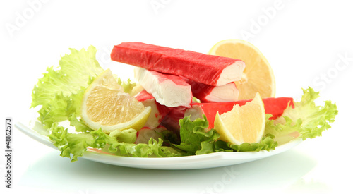 Photo: Crab sticks with lettuce leaves and lemon Crab sticks with lettuce leaves and lemon