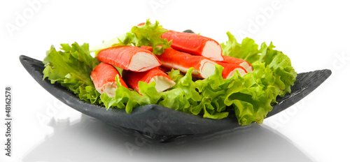 Photo: Crab sticks with lettuce leaves and lemon Crab sticks with lettuce leaves and lemon