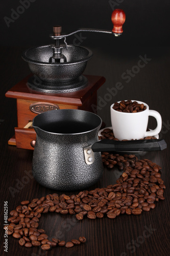Photo: Coffee maker and coffee mill on brown table Coffee maker and coffee mill on brown table