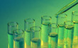 test-tubes with liquid on blue background