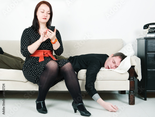 Photo: Woman checking telephone of her man Woman checking telephone of her man