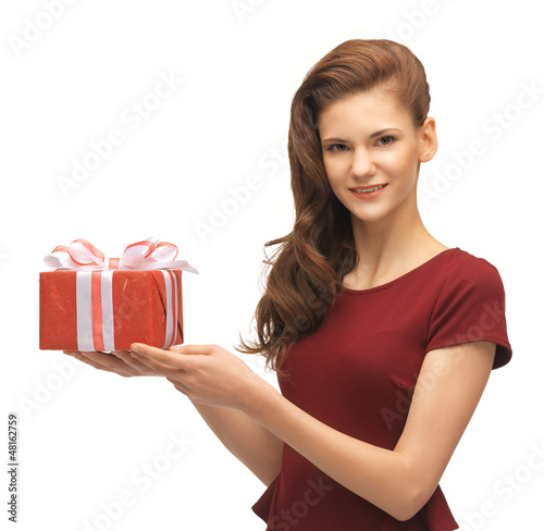 Photo: teenage girl in red dress with gift box teenage girl in red dress with gift box
