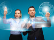 man and woman working with virtual touch screens
