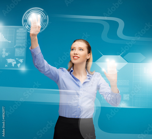 Photo: woman working with virtual screens woman working with virtual screens