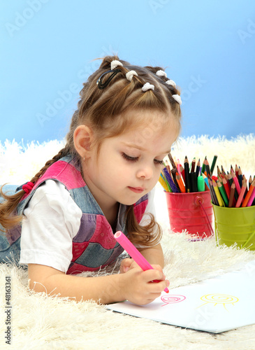 Photo: cute little girl playing with multicolor pencils, cute little girl playing with multicolor pencils,