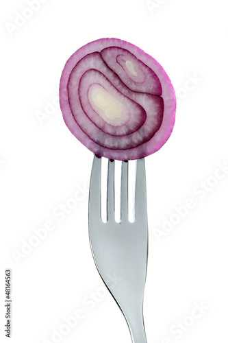 Photo: onion rings on fork against white onion rings on fork against white