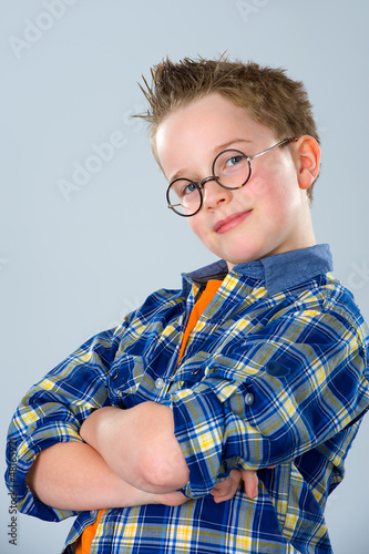 Photo: boy with stylish hair and round glasses boy with stylish hair and round glasses
