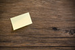 Post il on a wooden background