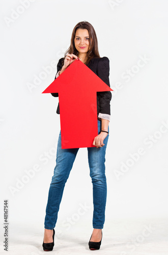 Photo: Beautiful woman holding an arrow pointing up Beautiful woman holding an arrow pointing up
