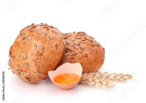 Photo: Bun with seeds and broken egg Bun with seeds and broken egg