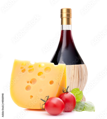 Photo: Red wine bottle, cheese and tomato still life Red wine bottle, cheese and tomato still life