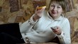 girl eats pizza and switches the TV remote control