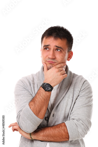 Photo: Sad handsome man isolated over white background Sad handsome man isolated over white background