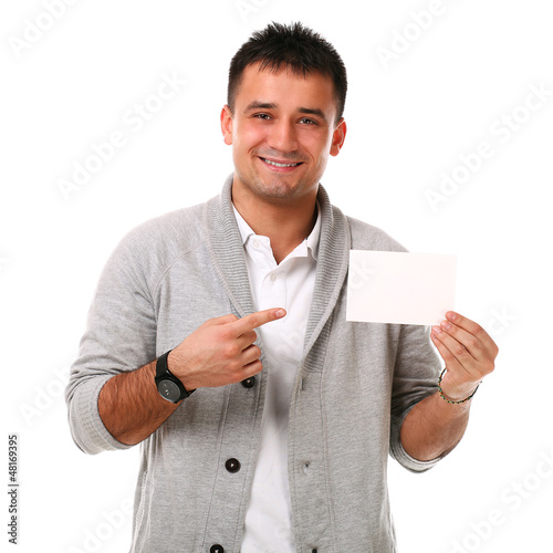 Photo: Young handsome man holding blank board Young handsome man holding blank board