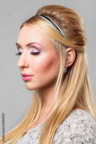 Photo: Portait of beautiful young woman with make-up Portait of beautiful young woman with make-up