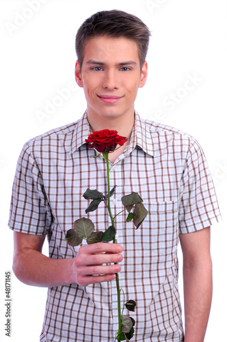 Photo: young boy with a flower in your hand young boy with a flower in your hand