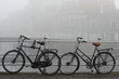 Leiden canal and bicycles in thick fog