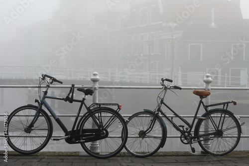 Photo: Leiden canal and bicycles in thick fog Leiden canal and bicycles in thick fog