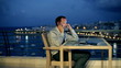 Vídeo: Businessman using cellphone, laptop and tablet on the terrace in Businessman using cellphone, laptop and tablet on the terrace in