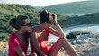 Female friend comforting sad woman near the vantage point, crane