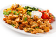 Grilled meat and vegetables on white background